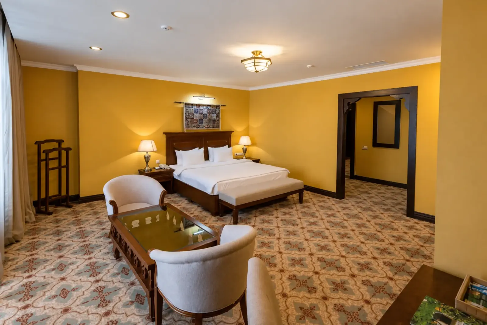 Double bed and seating area at Samal Resort & SPA